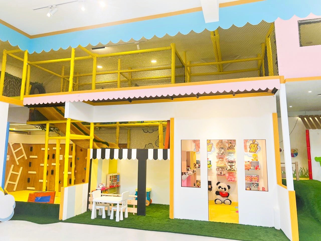 Indoor toddler play area at Gogo Village Dubai featuring climbing structures, soft play zones, and imaginative house-themed play setup.