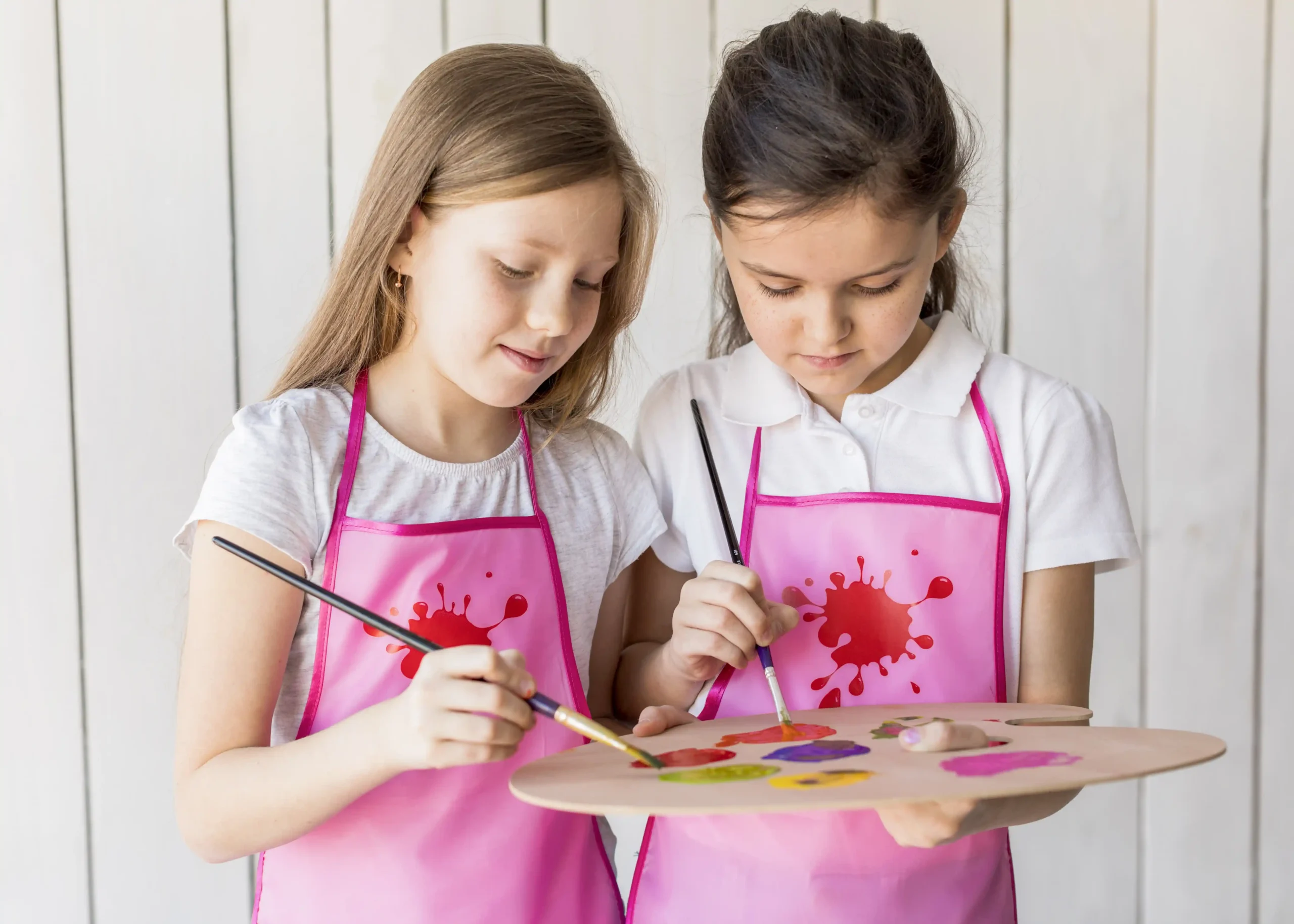 portrait-two-girls-using-palette-paint-with-paintbrush_11zon